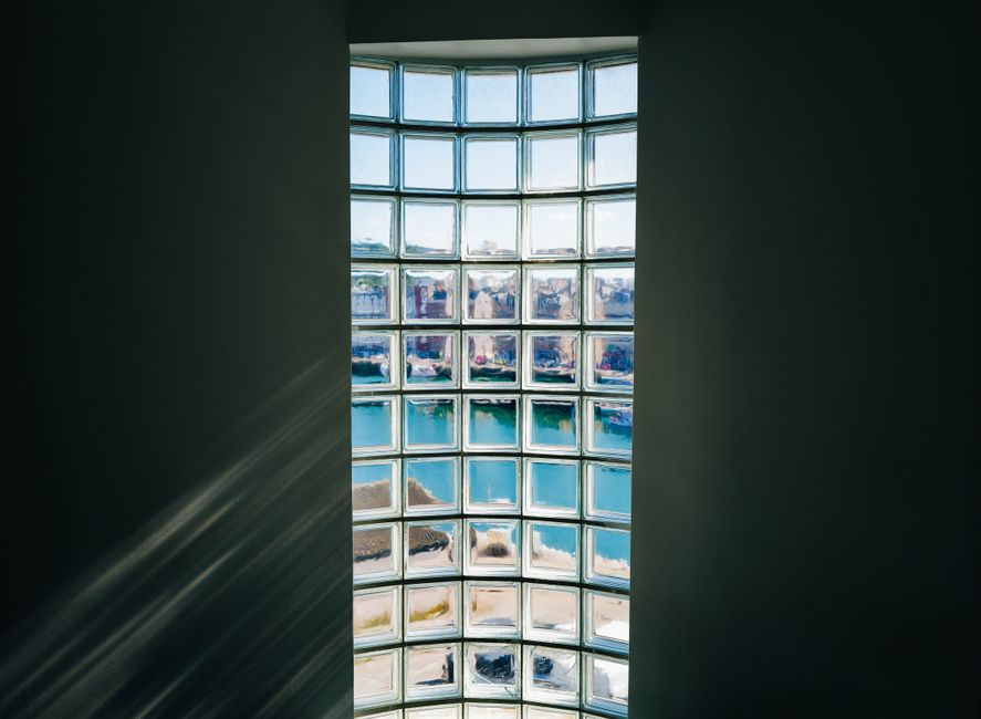 Sunlight streaming through newly installed energy efficient windows in a modern home