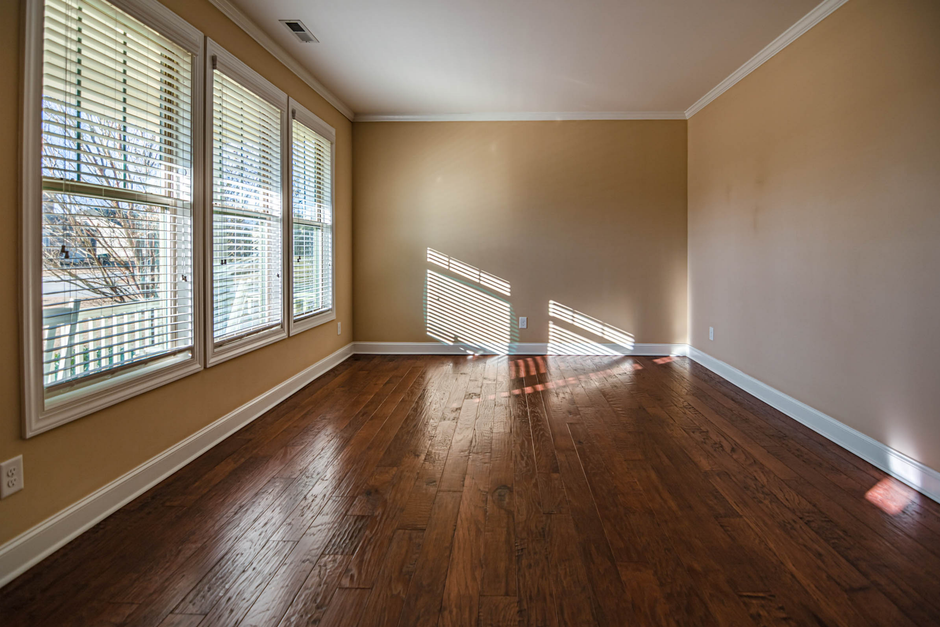 A beautiful living room featuring newly installed large replacement windows