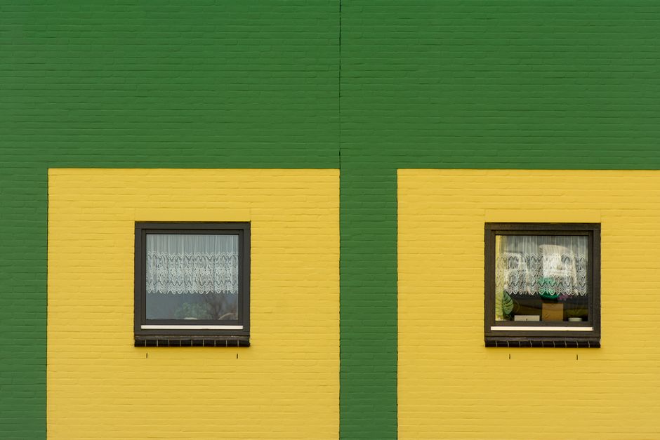 Modern house exterior showcasing pristine new replacement windows
